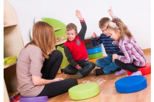 Children with teacher at circle time